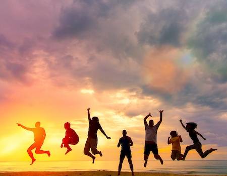 Group of friends celebrating on the beach